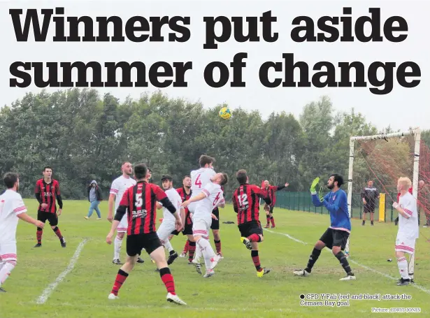  ?? Picture: ?? CPD Y Fali (red and black) attack the Cemaes Bay goal