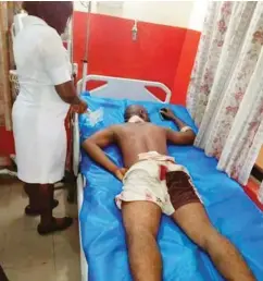  ??  ?? Affected officer receiving medical attention in the hospital Linus Effiong