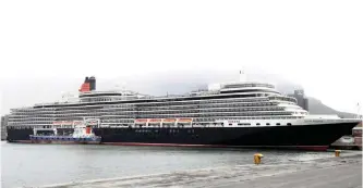  ?? AYANDA NDAMANE African News Agency (ANA) ?? CUNARD’S Queen Elizabeth cruise liner docked in the city yesterday. Motorists caused traffic jams as they slowed down along the inbound N1 stretch to ogle her majestic beauty. |