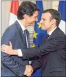  ?? CP PHOTO ?? Prime Minister Justin Trudeau, left, shakes hands with French President Emmanuel Macron as they hold a joint press conference at the Palais de l’Elysee in Paris, France on Monday.