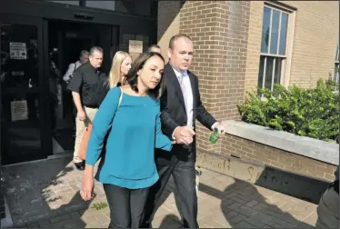  ?? The Sentinel-Record/Mara Kuhn ?? MISSING VIDEO: Division 2 Circuit Judge Wade Naramore, right, exits the Garland County Court House with his wife, Ashley, after Friday’s pretrial hearing. Naramore was charged with negligent homicide in February for the death of their 18-monthold son,...