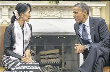  ?? BRENDAN HOFFMAN / NEW YORK TIMES ?? Aung San Suu Kyi, Myanmar’s opposition leader, meets with President Barack Obama on Wednesday in the Oval Office of the White House. Suu Kyi also accepted the Congressio­nal Gold Medal in the Capitol Rotunda.