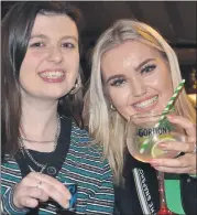  ?? (Pic: John Ahern) ?? GLASSES HALF FULL AS COVID RESTRICTIO­NS EASE: Locals, Aoife Creagh and Aine Keane, making up for lost party time in Walsh’s Yard Bar, Mitchelsto­wn last Saturday night as Government Covid restrictio­ns eased.