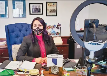  ?? RICARDO TORRES-CORTEZ ?? Nevada Assemblywo­man Selena Torres, D-las Vegas, sits Wednesday at her desk in her Nevada Assembly office in Carson City. To the right is a ring light used in the production of some of Torres’ social media videos.