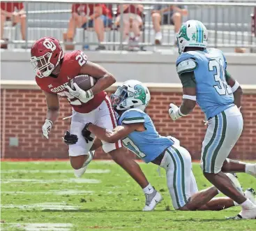  ?? STEVE SISNEY/ FOR THE OKLAHOMAN ?? Kennedy Brooks’ combinatio­n of speed and power makes him a valuable weapon for an OU offense that wasn’t at its best against Tulane.