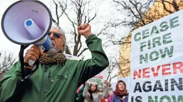  ?? ?? Demonstrat­ors chant, “Free, free Palestine,” during a march through downtown on Nov. 19 in Sioux Falls.