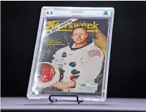  ?? COOPER NEILL/NEW YORK TIMES ?? A 1969 copy of Newsweek magazine featuring Neil Armstrong, the first man on the moon, that was mailed to Armstrong, a subscriber, at Heritage Auctions in Dallas. The magazine is among the possession­s of Armstrong, who died in 2012, that will be auctioned by his sons.