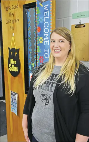  ?? STACI VANDAGRIFF/RIVER VALLEY & OZARK EDITION ?? Amanda Sellers, a biology teacher at Clinton High School, recently attended a national convention in Washington, D.C. Her advice to her students can be found printed on her classroom door: “Be so good they can’t ignore you.”