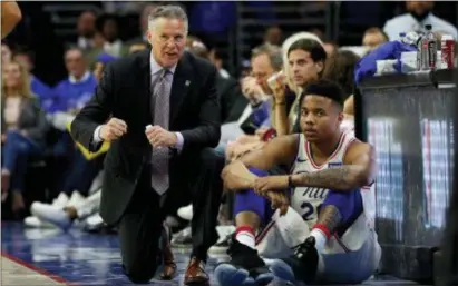  ?? CHRIS SZAGOLA — THE ASSOCIATED PRESS ?? Coach Brett Brown, left, talking with rookie guard Markelle Fultz during the first-round series with Miami, thinks the Sixers have an enticing mix of talent and culture to lure a big-name free agent in the offseason.