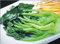  ?? PHOTOS PROVIDED TO CHINA DAILY ?? Left: Stir-fried mustard greens. The vegetables are usually stir-fried to lock in the juices so they stay crisp but do not taste raw and green. Right: Fried rice with mustard greens and salty cured meats.