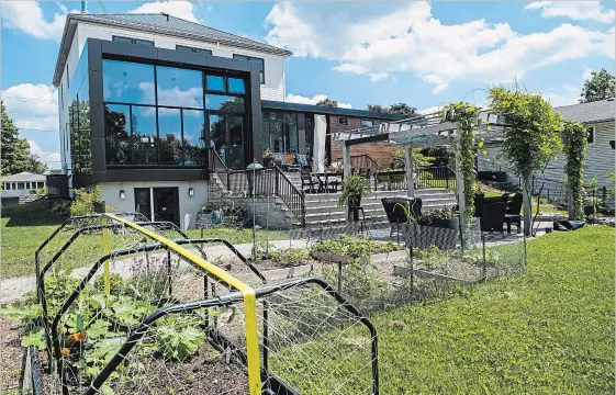  ?? ANDREJ IVANOV WATERLOO REGION RECORD ?? A former isolation hospital, this Waterloo home has been redesigned with the environmen­t in mind, with plenty of space and inspiring views to the backyard.