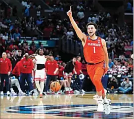  ?? RYAN SUN / AP ?? Clemson guard Chase Hunter celebrates after a win over Arizona in a Sweet 16 game Thursday in Los Angeles.