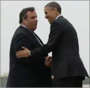  ?? PABLO MARTINEZ MONSIVAIS, FILE — ASSOCIATED PRESS ?? In this file photo, New Jersey Gov. Chris Christie greets President Barack Obama upon his arrival at McGuire Air Force Base, N.J. Obama traveled to New Jersey, joining Christie to inspect and tour the Jersey Shore’s recovery efforts from Hurricane...