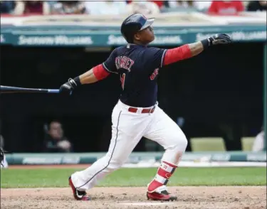  ?? RON SCHWANE — ASSOCIATED PRESS ?? Jose Ramirez hits a sacrifice fly during the sixth inning April 16 at Progressiv­e Field. The Tigers won, 4-1.