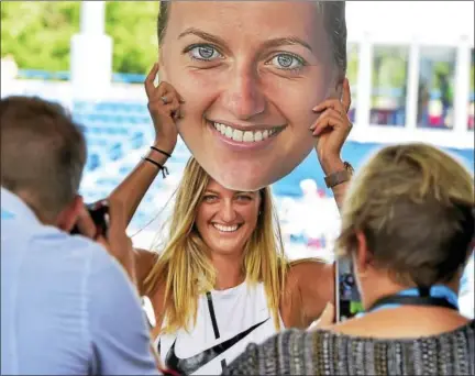  ?? PETER HVIZDAK/HEARST CONNECTICU­T MEDIA ?? Petra Kvitova has her photograph made during a promotiona­l event Sunday at the Connecticu­t Open.