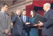  ?? SCOTT APPLEWHITE/ASSOCIATED PRESS ?? Vice President Mike Pence swears in Sen. Doug Jones, D-Ala., Wednesday as his wife, Louise, and sons Christoper, left, and Carson, center, look on.