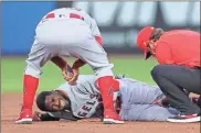  ?? AP-Mike Carlson ?? Los Angeles Angels manager Joe Maddon, top, leans over to check on Dexter Fowler who was injured during a play at second base against the Toronto Blue Jays during the second inning of a baseball in Dunedin, Fla., on April 9.