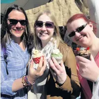  ??  ?? ●● APRIL: These three ladies were among the thousands who enjoyed the sun and treats at the record-breaking Ramsbottom Chocolate Festival