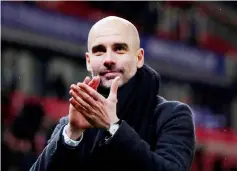  ??  ?? Manchester City manager Pep Guardiola applauds fans after the Premier League match. — Reuters photo