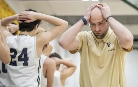  ?? Steph Chambers/Post-Gazette ?? REALLY? Franklin Regional boys coach Steve Scorpion reacts to a turnover Saturday in a game against Norwin in the Penn-Trafford tournament. Norwin defeated Franklin Regional, 49-46.