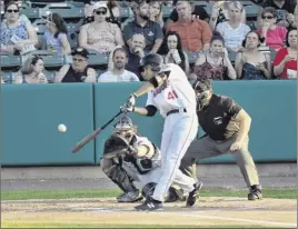  ?? Hans Pennink / Special to the Times Union ?? Tri-city’s Alex Mckenna hits in the first inning Saturday. He later picked up his first profession­al hit with a single in the fifth inning.