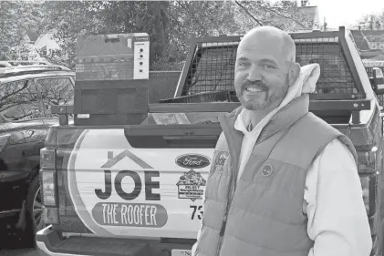  ?? THOMAS P. COSTELLO/ASBURY PARK PRESS ?? Joe the Roofer owner Joe Richmond is shown with one of his trucks in Freehold.