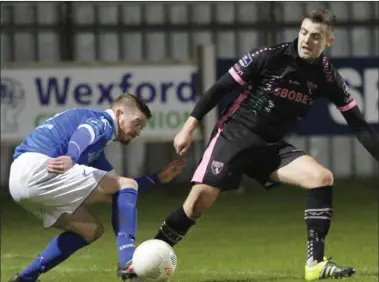  ??  ?? Right-back Craig McCabe keeping tabs on Finn Harps winger Adam Hanlon.