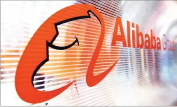  ?? ALAIN JOCARD /AFP ?? A logo of the Chinese multinatio­nal e-commerce, retail, internet, and technology conglomera­te, Alibaba group, is seen on a window of a stand during the Vivatec trade fair on May 24 in Paris