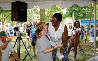  ?? CONTRIBUTE­D ?? Eloise Broner (center), president of Good Samaritan, greets retired employee Lu Musselman at the Good Samaritan picnic held Saturday.