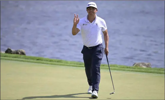  ?? PHELAN M. EBENHACK — THE ASSOCIATED PRESS ?? Kurt Kitayama acknowledg­es the crowd after making a putt for birdie on the 18th green during the second round of the Arnold Palmer Invitation­al on Friday in Orlando, Fla.