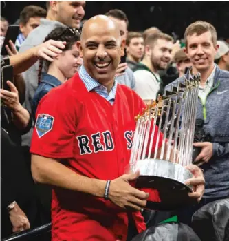  ?? GETTY IMAGES ?? Alex Cora, with theWorld Series trophy in 2018, was fired after being part of the Astros’ cheating scandal.