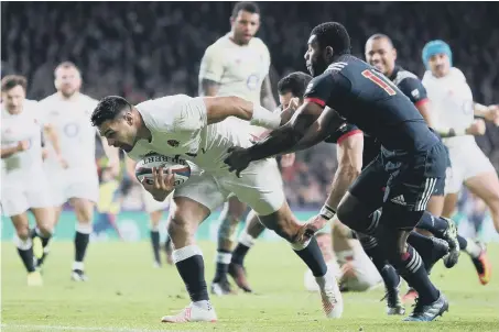  ??  ?? Winning score: England’s Ben Te’o barges over the French line for the decisive score in coming from 16-12 down to win at Twickenham