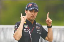  ?? CLIVE ROSE/ GETTY IMAGES ?? Sergio Perez of Mexico and Oracle Red Bull Racing walks in the Paddock during previews ahead of the F1 Grand Prix of Canada at Circuit Gilles Villeneuve on Thursday in Montreal.