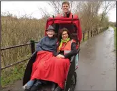  ??  ?? Fraser Johnston on the bike with Jim Taylor and the project co-ordinator, Christine Bell