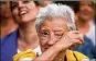  ?? JEFF J. MITCHELL / GETTY IMAGES ?? Pro-independen­ce backers in Barcelona wait for Puigdemont’s address.