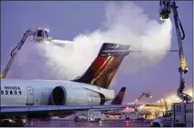  ?? DELTA AIR LINES ?? Delta had 44 de-icing trucks, which lift workers in buckets into the air to spray down planes with de-icing fluid. A large plane can be de-iced by four trucks at a time.