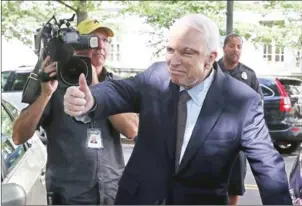  ?? MARK WILSON/GETTY IMAGES/AFP ?? Senator John McCain gives a thumbs up to well wishers as he gets into his car at the US Capitol on Tuesday in Washington, DC.