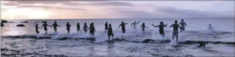  ?? Photograph: Eilidh Kerr. ?? Dookers running into the water at the Shiskine Valley dook.