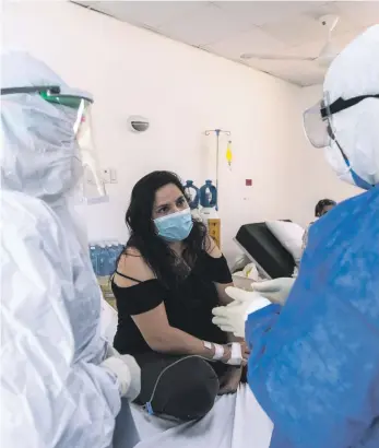  ?? AFP ?? Una paciente de nacionalid­ad venezolana se recupera en el hospital Santo Socorro./