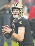  ??  ?? Saints quarterbac­k Drew Brees looks to pass in the first half.