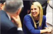  ?? Hearst Connecticu­t Media ?? State Rep. Caroline Simmons, D, Stamford, smiles while chatting with fellow representa­tives during the opening day of the 2017 legislativ­e session at the Capital in Hartford.