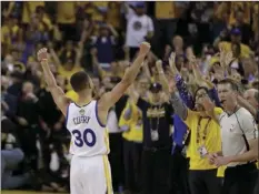  ??  ?? Golden State Warriors guard Stephen Curry celebrates with fans after Game 5 of basketball's NBA Finals between the Warriors and the Cleveland Cavaliers on Monday in Oakland. AP PHOTO