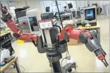  ?? Ricardo DeAratanha Los Angeles Times ?? AN INDUSTRIAL robot named Baxter, produced by Rethink Robotics, stands ready to work at the new USC manufactur­ing center.