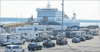  ?? JEREMY FRASER/CAPE BRETON POST ?? Passenger and commercial traffic line up at the Marine Atlantic terminal in North Sydney to board the MV Highlander­s for a crossing between North Sydney and Port aux Basques, N.L. on Aug. 7. The crossing was scheduled to leave Nova Scotia at 12:15 p.m., however the vessel left early, leaving port at 11:45 a.m.