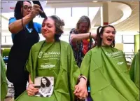  ?? FILE PHOTO ?? A tear rolls down Peyton Hill’s face as she has her head shaved in memory of her friend, Audrey Lupton, who died of cancer in 2017. Hill and Hayden Hotchkiss, at right, had their heads shaved at the St. Baldrick’s fundraisin­g event at Boulder High School in 2018.