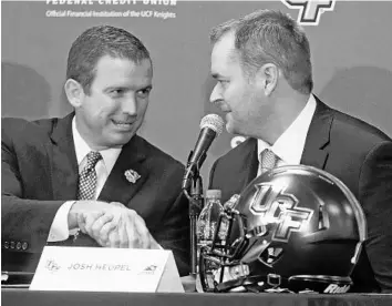  ?? RED HUBER/STAFF PHOTOGRAPH­ER ?? UCF athletics director Danny White, left, said he was looking for a coach of high character who ran a speedy, high-powered offense. He found both in Josh Heupel, the offensive coordinato­r at Missouri the last two seasons.