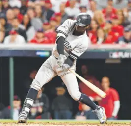  ?? Jason Miller, Getty Images ?? The Yankees’ Didi Gregorius connects for his second homer of the game, a two-run shot in the third inning against the Indians.
