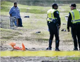  ?? RALPH BARRERA / AMERICAN-STATESMAN ?? A vehicle struck and killed a pedestrian near East Anderson Lane at Norwood Park Boulevard in North Austin on Thursday morning. The victim was a man in his 40s who was pushing a shopping cart across the street.