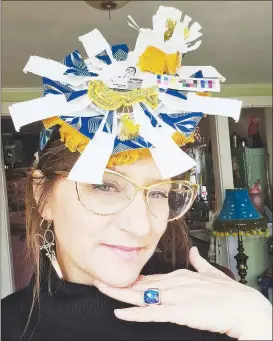  ?? (Courtesy Photo) ?? Artist Gina Gallina models her “trash hat” made from recycled and upcycled materials. The hat is an example of the recent WowZa workshops led by Gallina at Mount Sequoyah. On Feb. 10 an event dedicated to the wonders of wearable art, the Wowza Ball, kicks off at 6 p.m. at Millar Lodge at Mount Sequoyah.