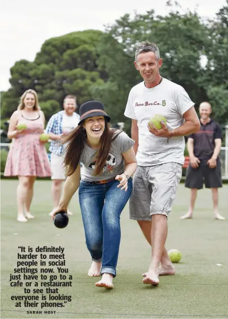  ?? Picture: ALAN BARBER ?? EVENTS HOST: Sarah Host, pictured playing lawn bowls with Ben Dekker, has establishe­d Organic Fusions, which offers group activities for singles to meet other singles.